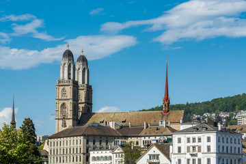 City view of old downtown of Zurich city, with beautiful house, and Church of Grossmunster (great minster Church)