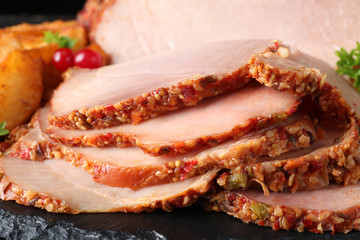 Delicious ham on slate plate, closeup view