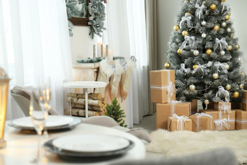 Decorated Christmas tree in modern living room interior