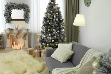 Decorated Christmas tree in modern living room interior
