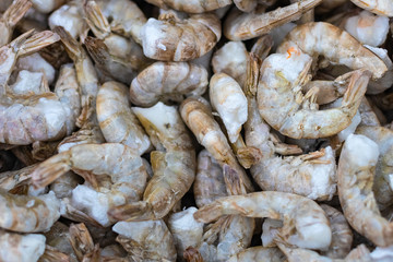 Fresh white shrimp frozen in ice. Selective focus.