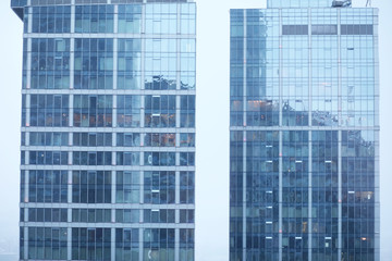 Buildings made of glass and concrete. Skyscrapers in the city.