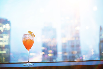 Cocktail glasses on the windowsill by the glass