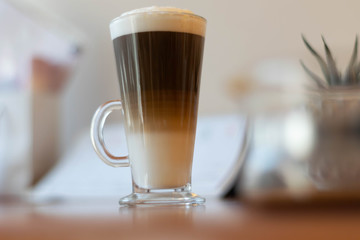 cup of coffee of wooden table