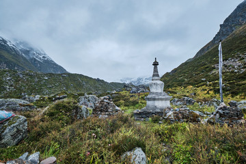 Fototapeta premium Stupa, fog and mountains