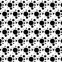 The surface of the circle is large and black in an abstract pattern.
