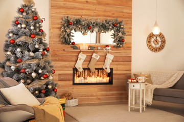 Beautiful interior of living room with decorated Christmas tree