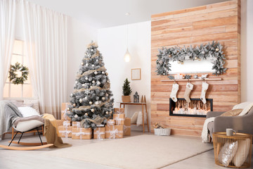 Beautiful interior of living room with decorated Christmas tree