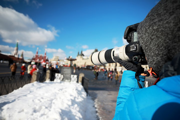 Journey. Tourist with a camera takes photos of beautiful places.