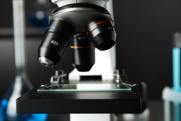 Fototapeta na wymiar Modern microscope with different lenses in laboratory, closeup. Medical equipment