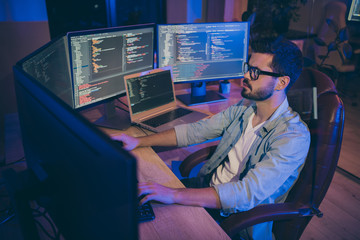 Photo of it specialist guy sitting comfy office chair holding hands on keyboard looking many...