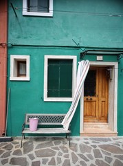 Exterior of a green house in Burano, Venice