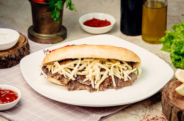 meat doner with yellow cheese on the table