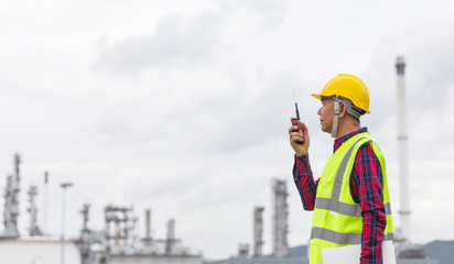 Male foreman using radio to communicate the work order