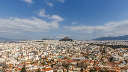 Fototapeta na wymiar Athens cityscape, and Lycabettus Hill with blue sky