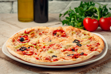 pizza with bell pepper on the table ____