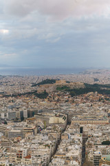 Sunset landscapes in Athens with ancient Acropolis and old city