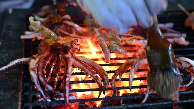 4K Grilled squids and octopus Street food on the food market in Taipei,Taiwan