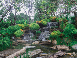 view of beautiful waterfall in green garden background - 298071704