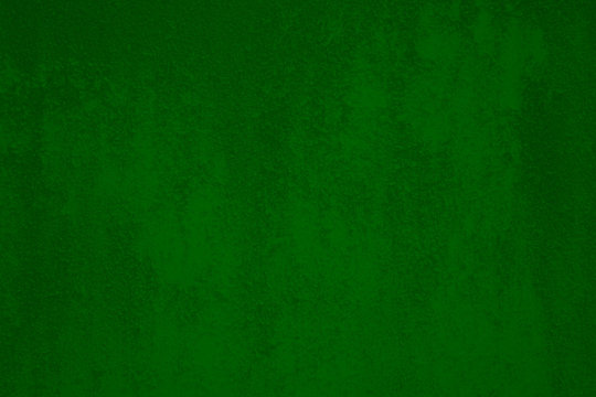 Dark green rough grunge damage wall distress background texture