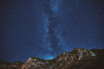Astrophotography. Milky way on mountain background