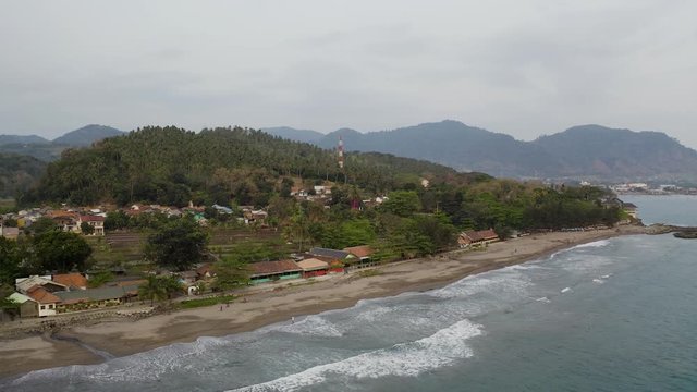Aerial 4K drone flying over Tropical Beach of Pelabuhan Ratu in Suka Bumi, West Java, Indonesia. Drone Videos on tropical beach