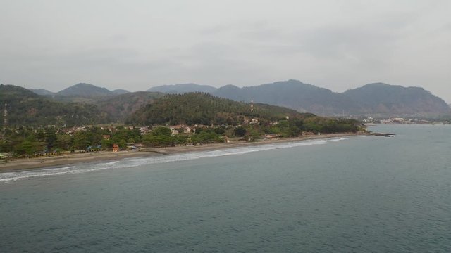 Aerial 4K drone flying over Tropical Beach of Pelabuhan Ratu in Suka Bumi, West Java, Indonesia. Drone Videos on tropical beach