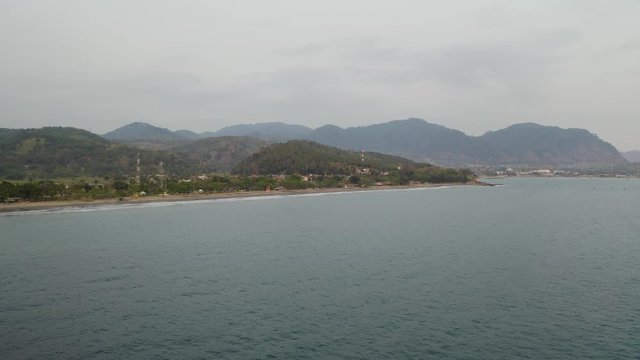 Aerial 4K drone flying over Tropical Beach of Pelabuhan Ratu in Suka Bumi, West Java, Indonesia. Drone Videos on tropical beach