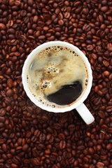 Coffee beans and coffee Americano on the table