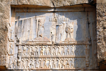Sassanian stone reliefs in Naqsh-e Rostam (rock tombs of ancient iranian kings Darius III, Artaxerxes I, Darius I and Xerxes I). Iran.