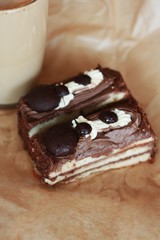 Delicious cakes with chocolate and coffee close up