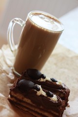 Delicious cakes with chocolate and coffee close up