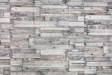 Wooden mosaic wall. Mosaic of gray old wooden slats.