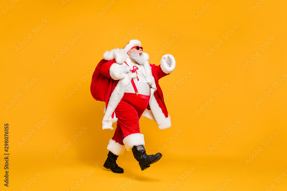 Sticker full size profile side photo of funky fat santa claus with huge abdomen hold gift wish bag go walk t