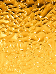 Drops of water on a gold background