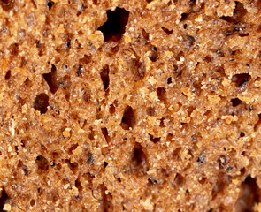 Black rye bread as an abstract background