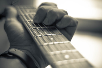 hands on guitar strings