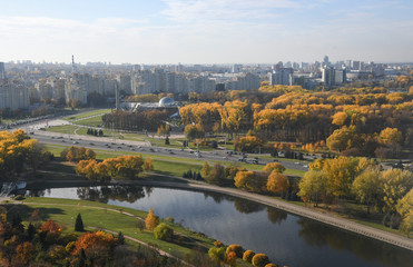Fototapeta na wymiar Aerial view of Minsk city. Autumn Victory Park and Svisloch River. Belarus