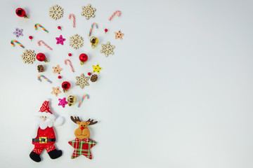 Christmas background concept.Top view of santa claus and reindeer splash out christmas decoration with candy cane, snowflake, star and colorful ball on white background with copy space for text.