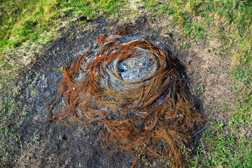 ash left by burning a tire on the field