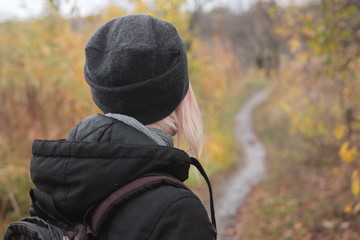 young woman in black hat in the autumn park