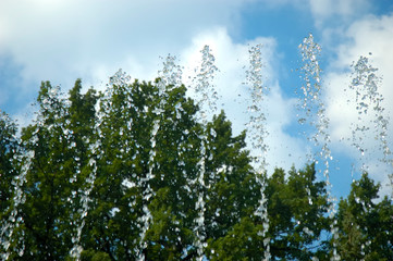The gush of water of a fountain.