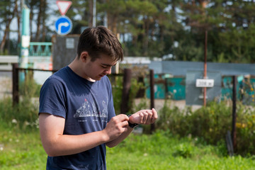 Teen boy with a racket in hand plays badminton