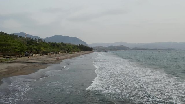 Aerial 4K drone flying over Tropical Beach of Pelabuhan Ratu in Suka Bumi, West Java, Indonesia. Drone Videos on tropical beach