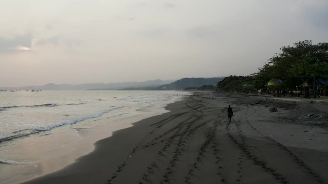 Aerial 4K drone flying over Tropical Beach of Pelabuhan Ratu in Suka Bumi, West Java, Indonesia. Drone Videos on tropical beach