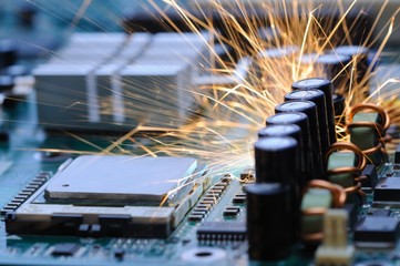 Burning sparks fly from a circuit chip