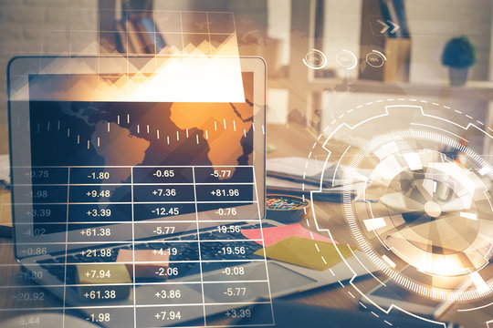 Financial graph colorful drawing and table with computer on background. Double exposure. Concept of international markets.