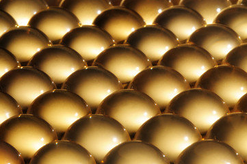 Close-up large shiny balls lie next to each other