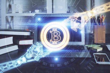 Multi exposure of blockchain theme hologram and table with computer background. Concept of bitcoin...