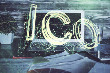 Multi exposure of blockchain theme hologram and table with computer background. Concept of bitcoin...